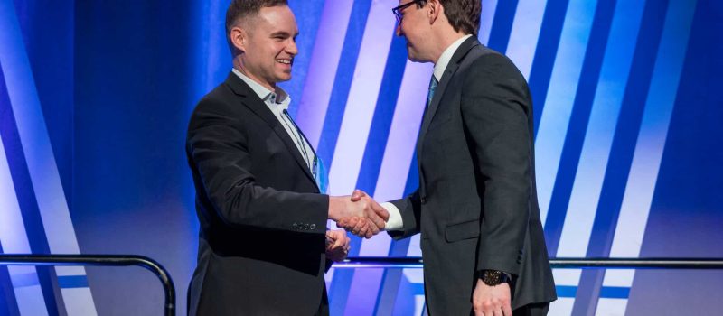 Kyle Christensen receiving the awards from Minister Dreeshen on behalf of Volker Stevin Highways at the CEA Transportation Connects Awards Conference on March 9, 2026.